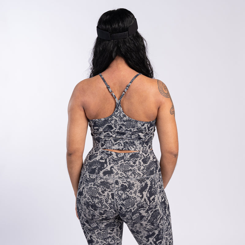 Back view womens snake-print sports bra with racerback straps
