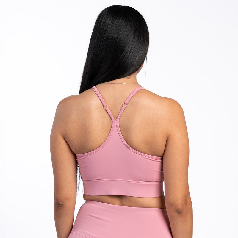 Rose pink sports bra with crisscross back straps and scoop back