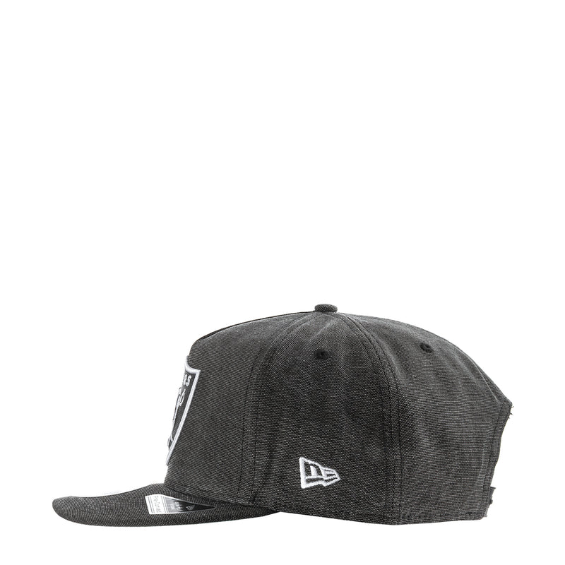 Washed black Raiders denim cap with small side logo patch and curved brim