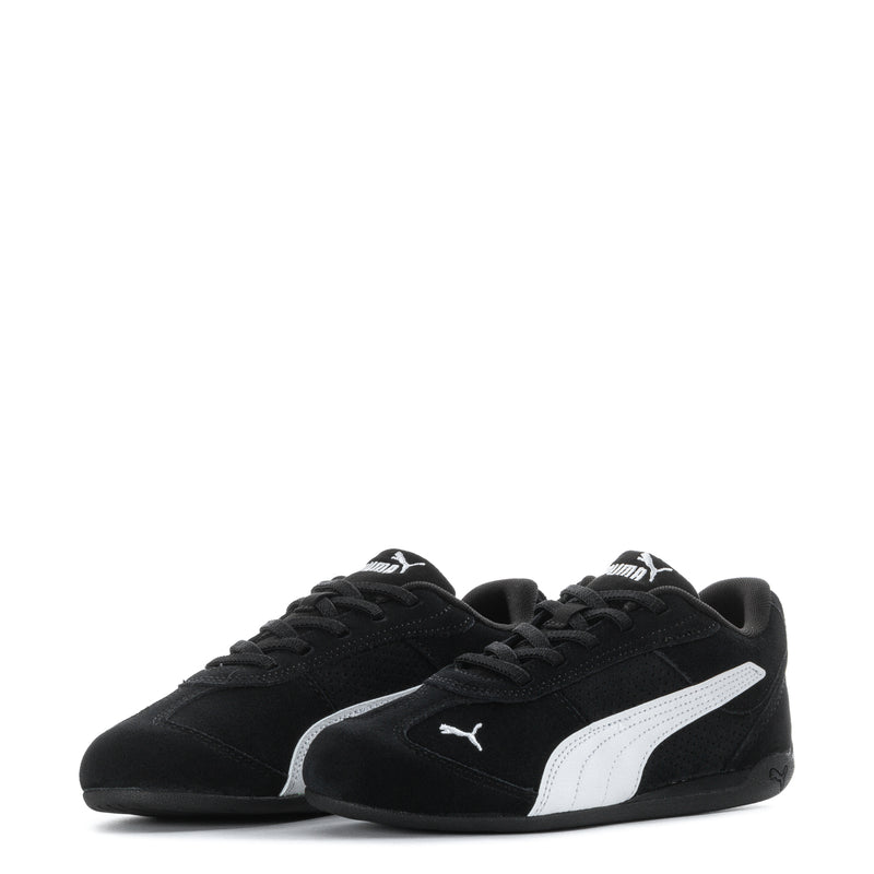 Pair of kids black Puma sneakers with white side stripe and lace-up design