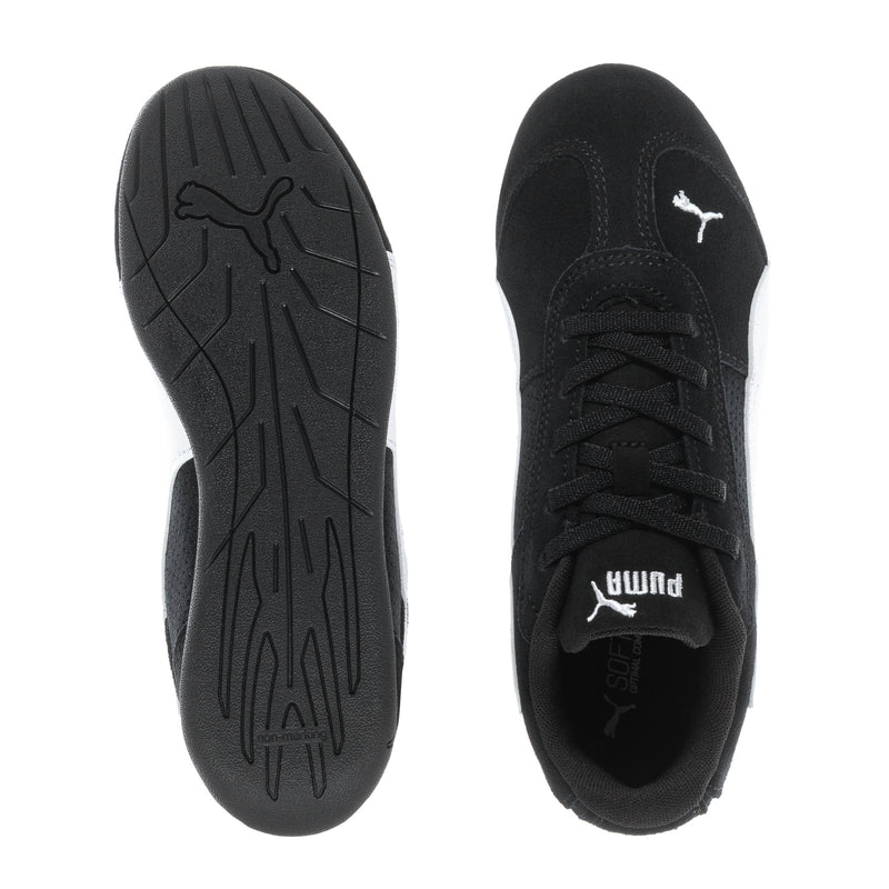 Kids black sneakers showing outsoles and toe area with Puma logo on upper