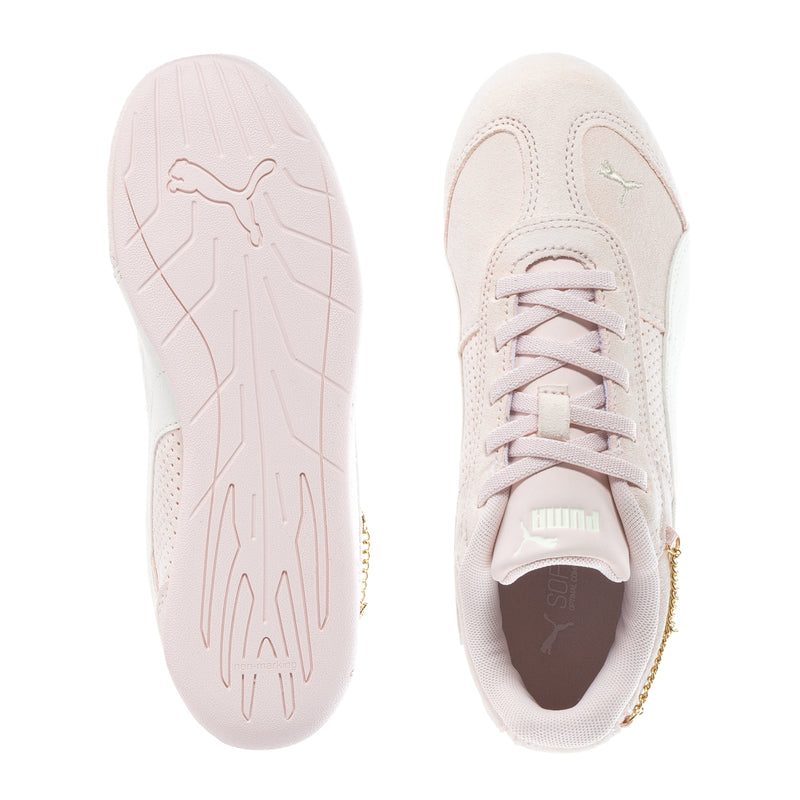 Kids sneakers, sole and tongue view, light beige with Puma logo on outsole