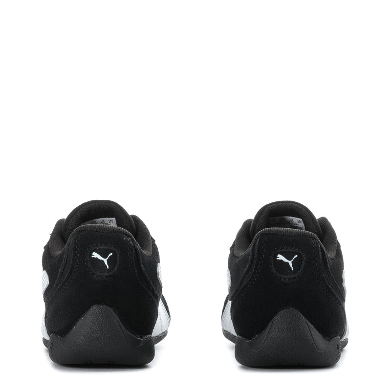 Kids black Puma sneakers heel view with logo on back tab and contrast trim
