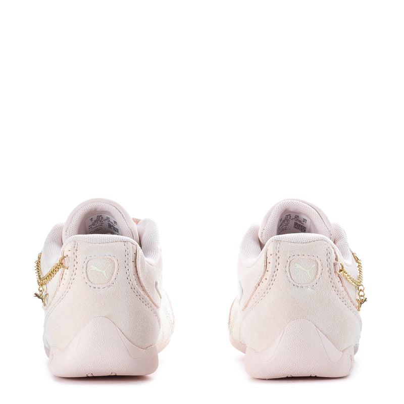 Kids sneakers heel view, light beige suede with lace-up and gold heel hardware
