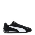 Youth black Puma suede sneakers with white stripe and lace-up front