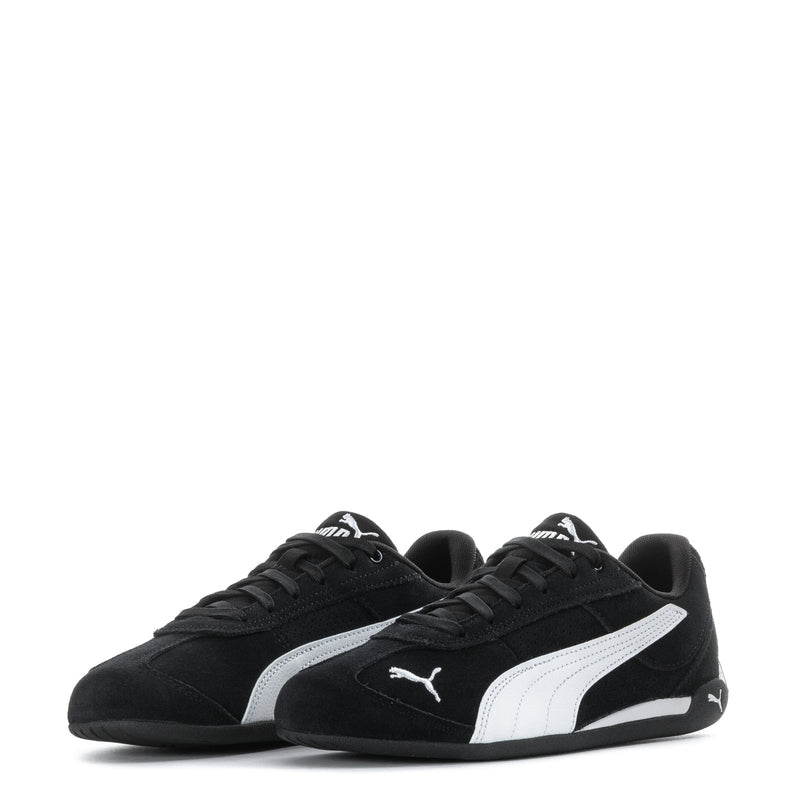 Youth black Puma suede sneakers pair view with white stripes and Puma logos