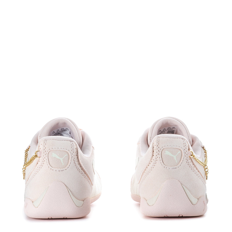 Youth sneaker heel view, light pink with Puma logo and gold side chain trim