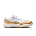 Women’s low-top sneakers in white and metallic gold with chunky rubber sole