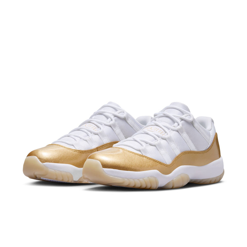 Women’s low-top sneakers, white upper with metallic gold accents and thick outsole