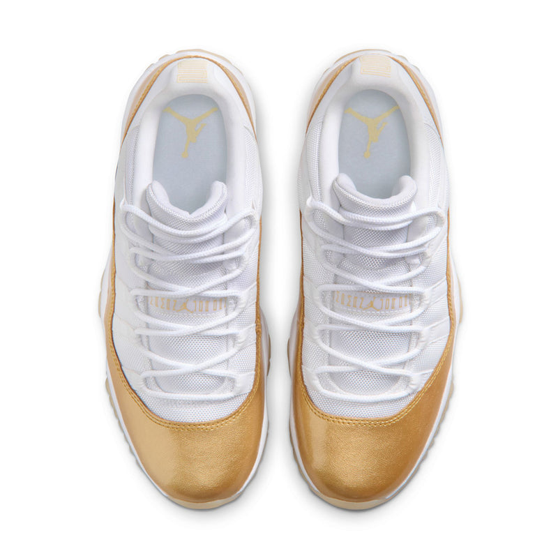 Pair of white and gold low-top sneakers with lace-up front and cushioned collars