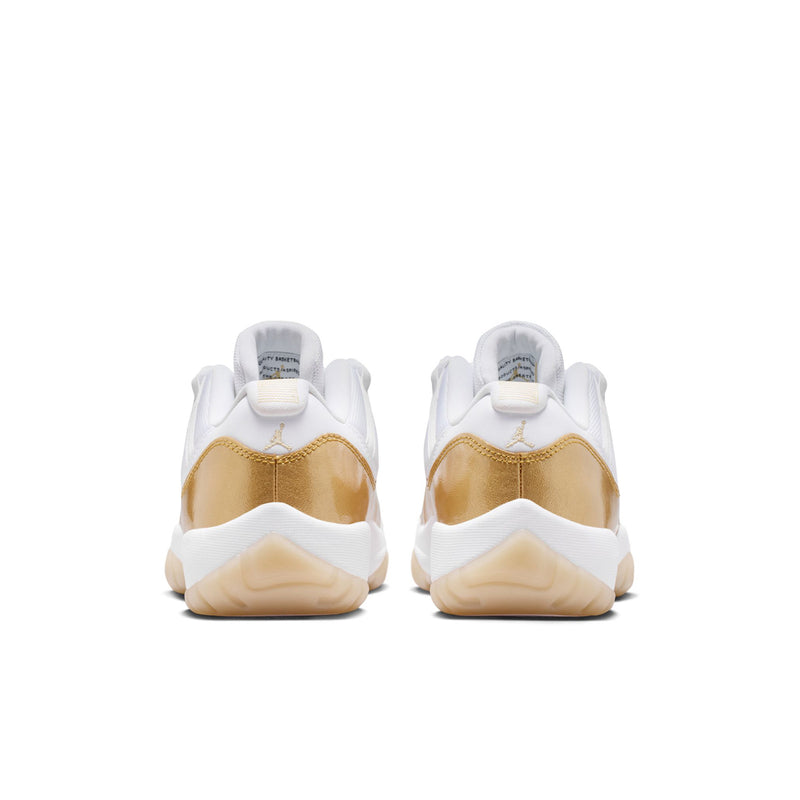 Rear view of white and gold low-top sneakers with back heel tabs