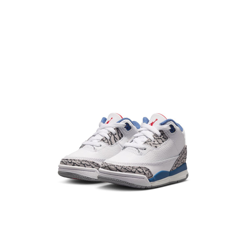 Toddler retro sneakers, white upper with blue swoosh, gray speckled detail, and red heel accents