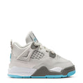 Toddler low-top sneakers in white and gray with blue outsole accents