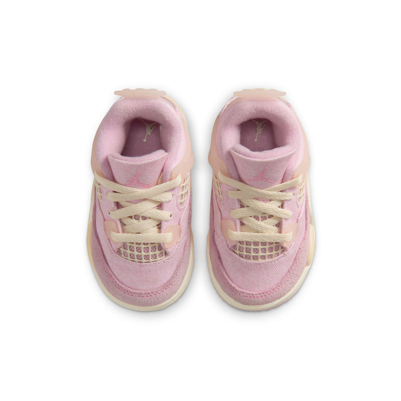 Toddler sneakers with pink padded tongue and cream laces, top view
