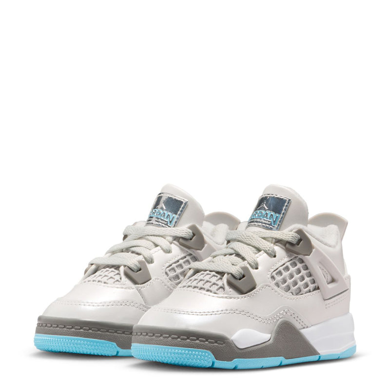 Toddler white sneakers with gray trim, blue outsole, and side mesh detail