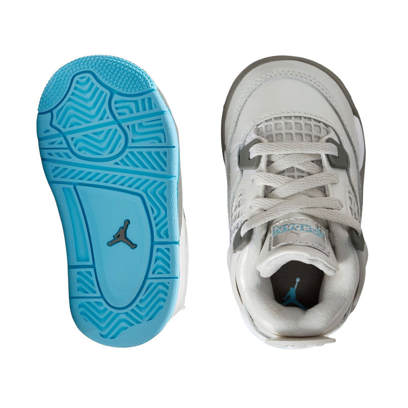 Toddler sneaker outsole view: blue traction tread and gray heel area