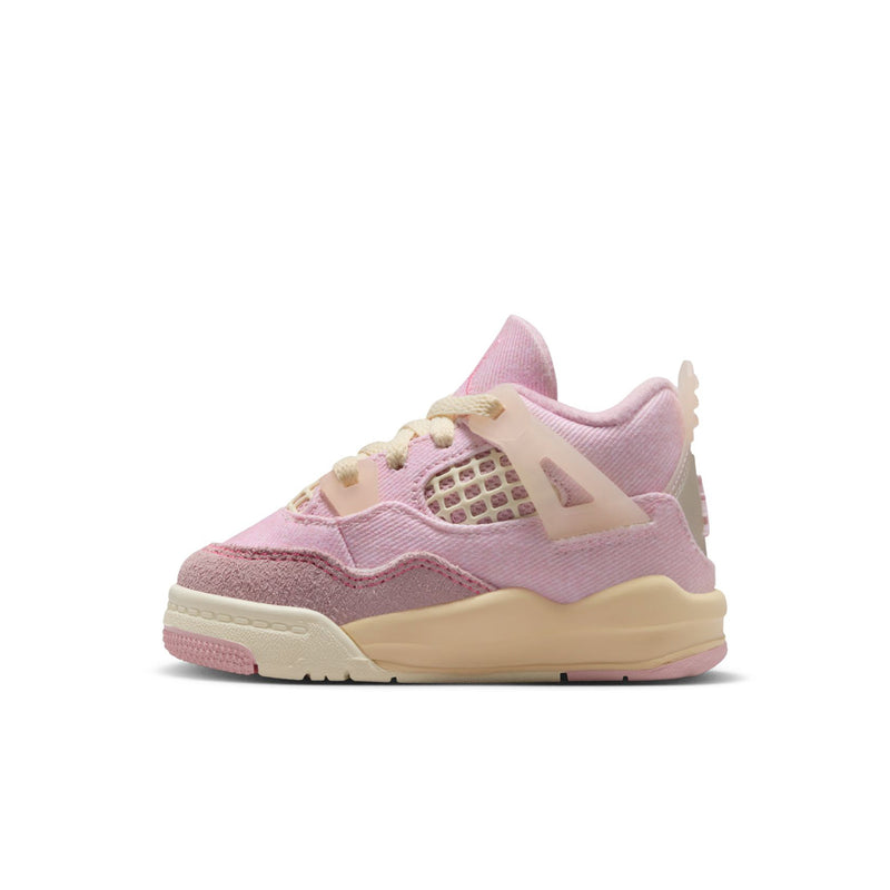 Toddler low-top sneakers in pastel pink, cream midsole, and lace-up closure
