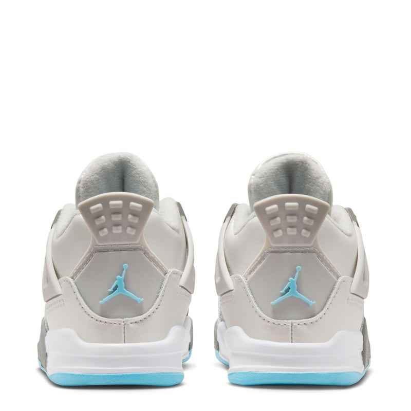 Toddler back view of white sneakers with gray heel pads and blue sole