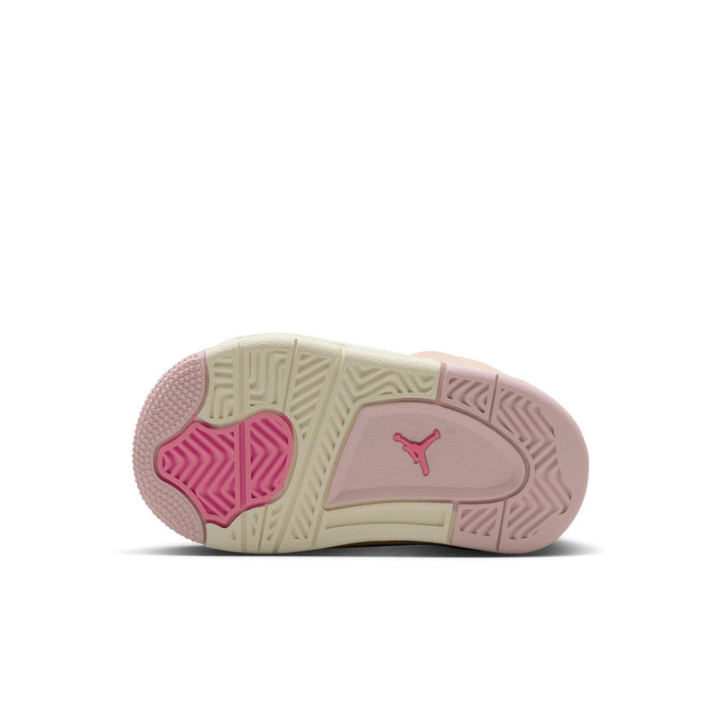 Toddler sneaker outsole view with pink traction pods and cream midsole