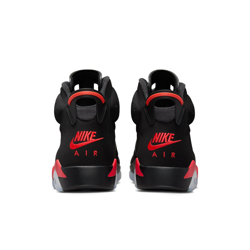 Black high-top sneakers with NIKE AIR logo and red heel accents
