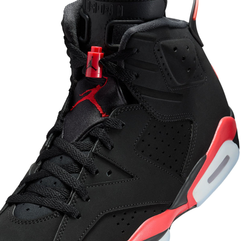 Black high-top sneaker close-up with laces and red Jumpman detail