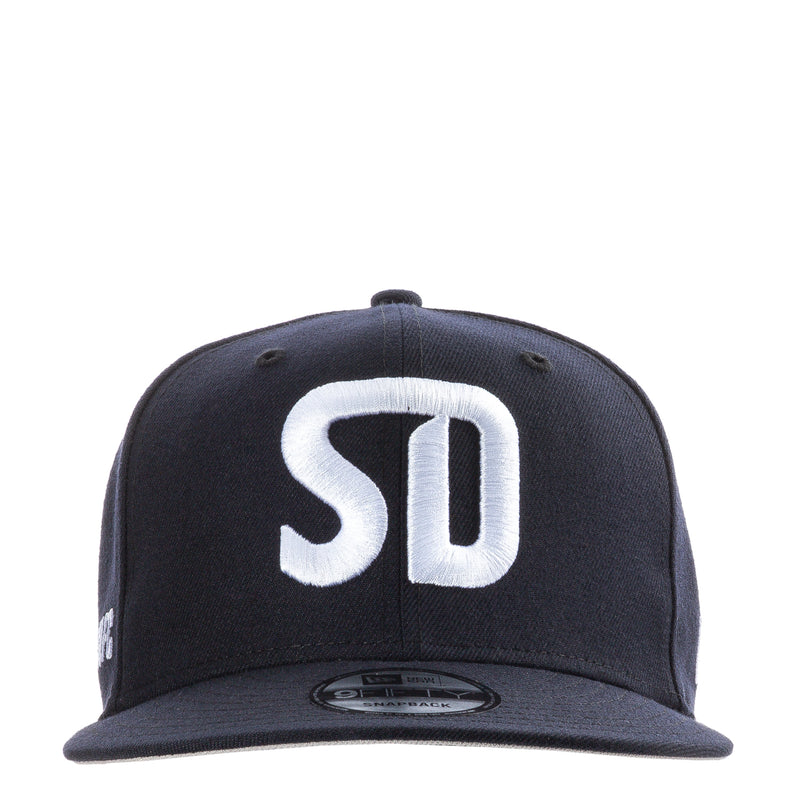 Navy baseball cap with white SD logo on front panel