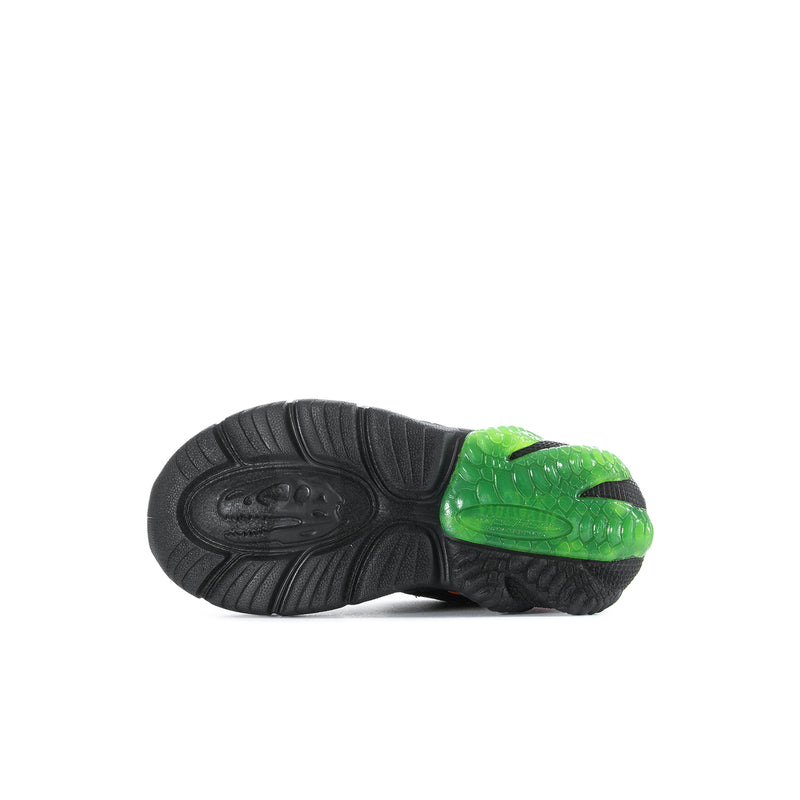 Kids' sneaker sole with black tread and bright green outsole section