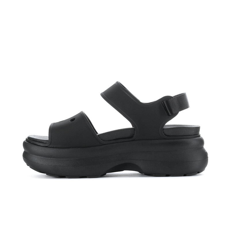 Black Y-strap platform sandal side view with textured footbed