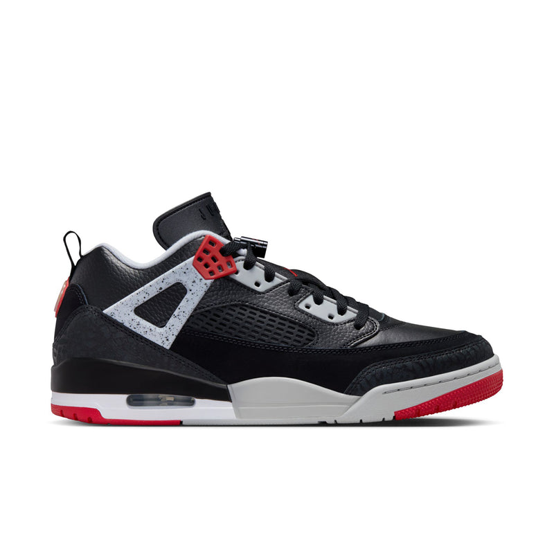 Men's low-top sneakers in black with white panels and red heel accents