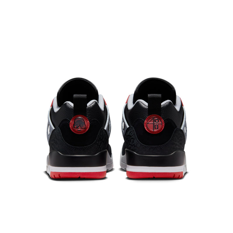 Men's black low-top sneakers, rear view with red heel tabs and gray sole