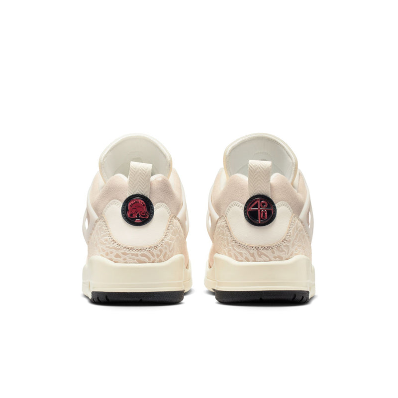 Cream low-top sneakers with rear heel tabs and red circular logo on the back
