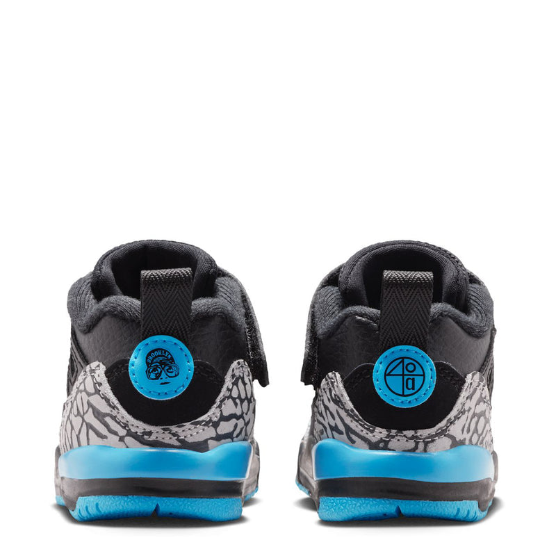Black toddler sneaker heel view with blue pull tab and speckled back