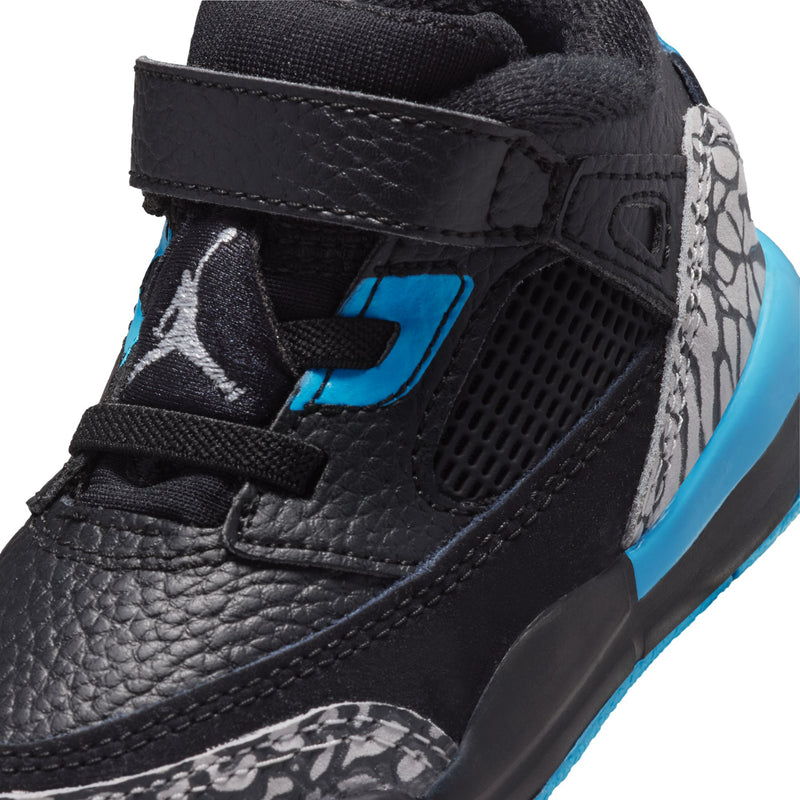 Black leather toddler sneaker quarter with mesh vent, blue logo and speckled detail