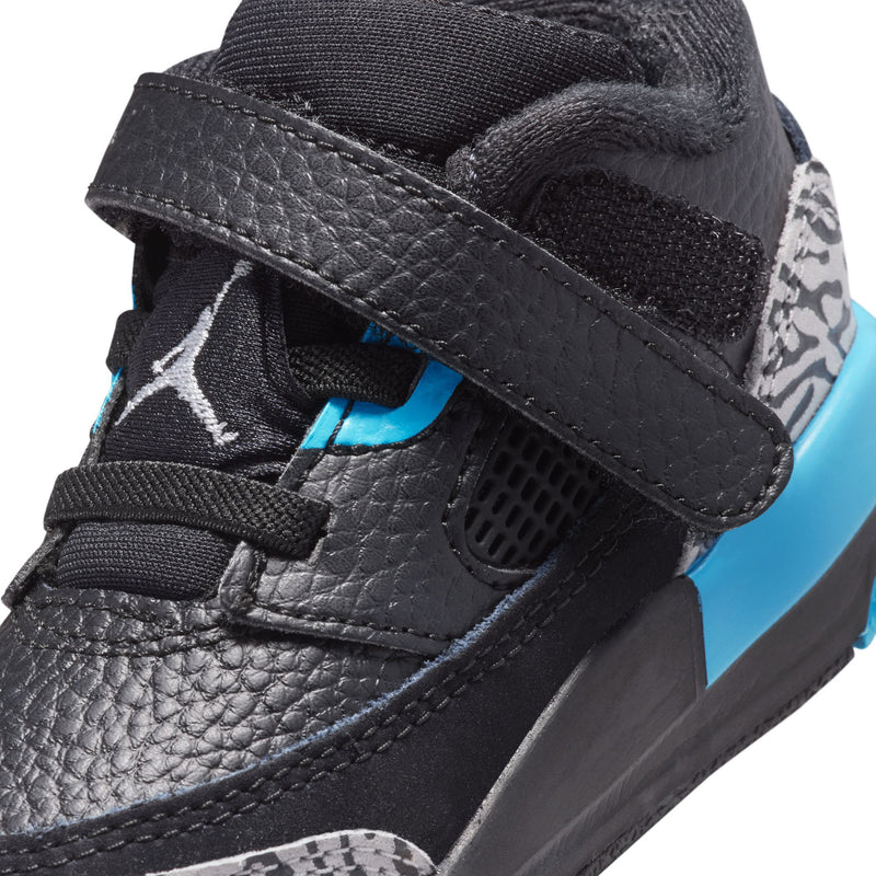 Black toddler sneaker with hook-and-loop strap, blue logo, mesh vent and speckled side