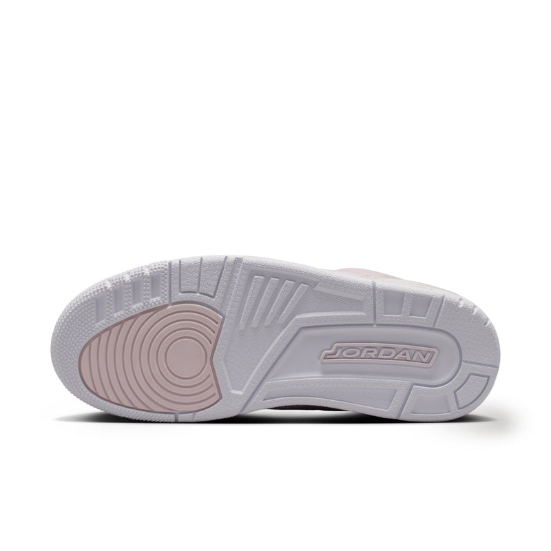 Sole of women’s low-top sneakers in light gray with textured tread and Jordan logo