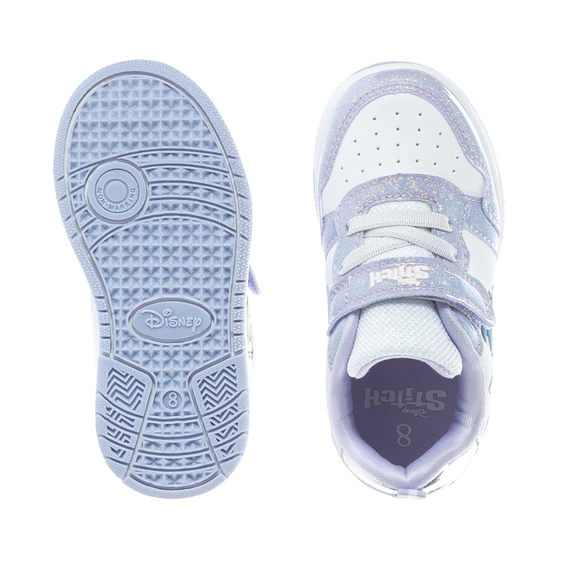 White and purple toddler sneaker soles with Disney logo and textured tread