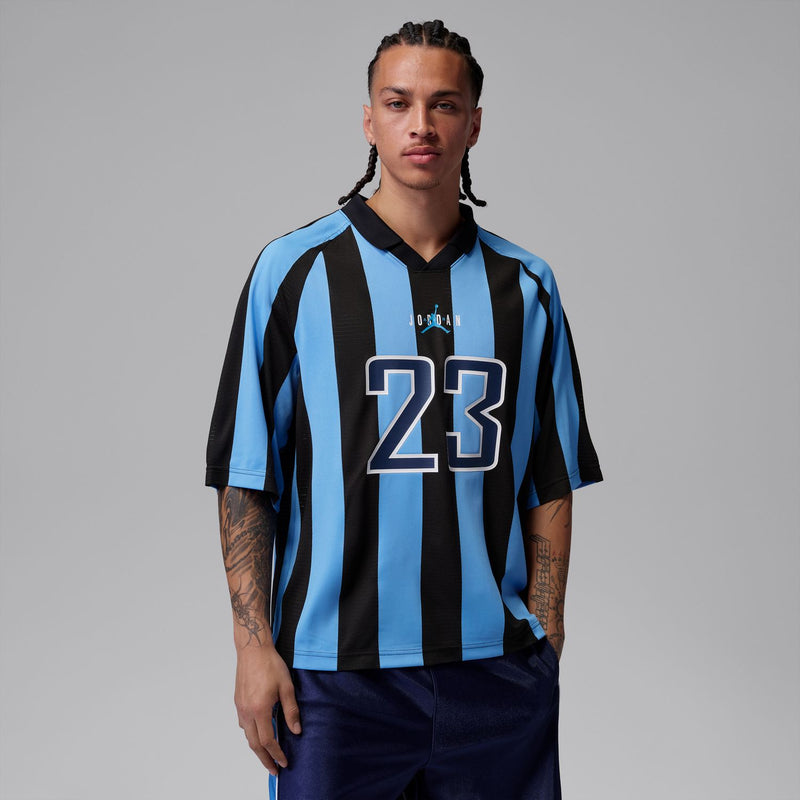 Men's short-sleeve jersey top on model, blue-and-black stripes with 23 front print