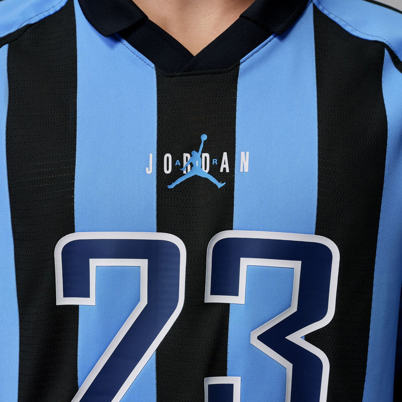 Jersey chest close-up with Jordan logo and large 23 print on blue-and-black stripes
