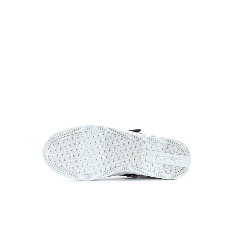 Kids sneaker outsole with white tread pattern and dark stripe near the heel