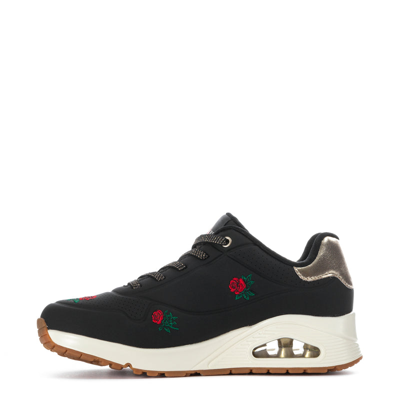 Black lace-up sneaker with gold-capped air window, rose embroidery and white sole