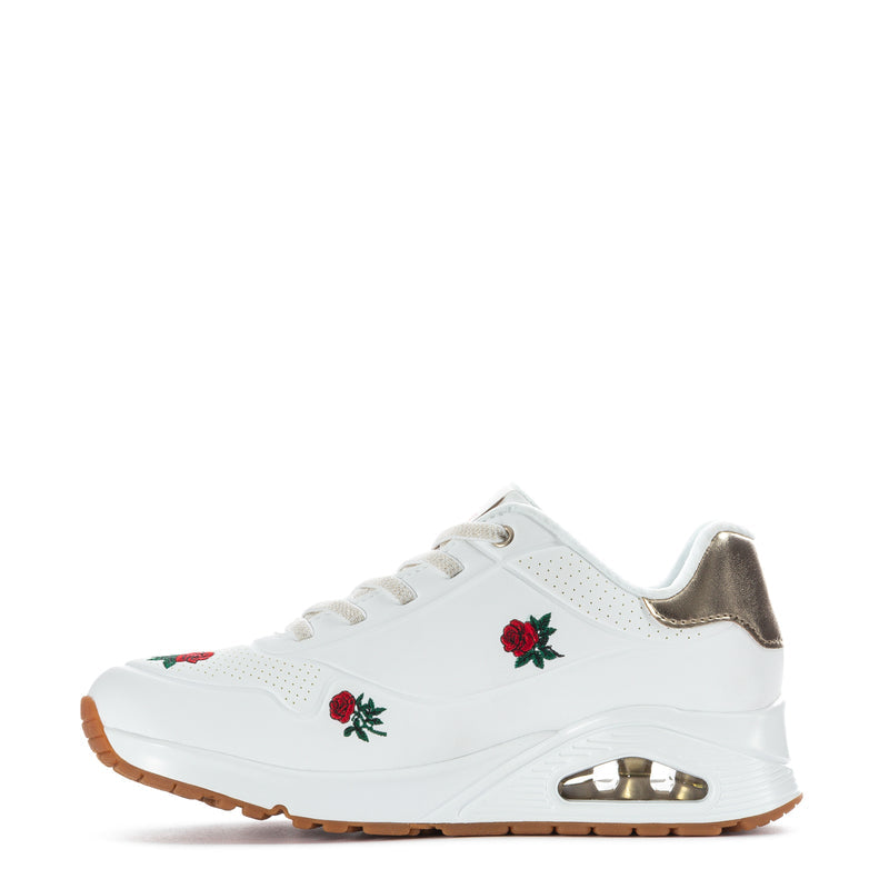 White women's lace-up sneaker with red rose embroidery and metallic gold heel detail