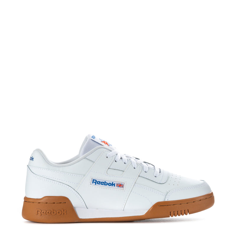 White youth Reebok lace-up sneaker with gum sole and side logo, low-profile.